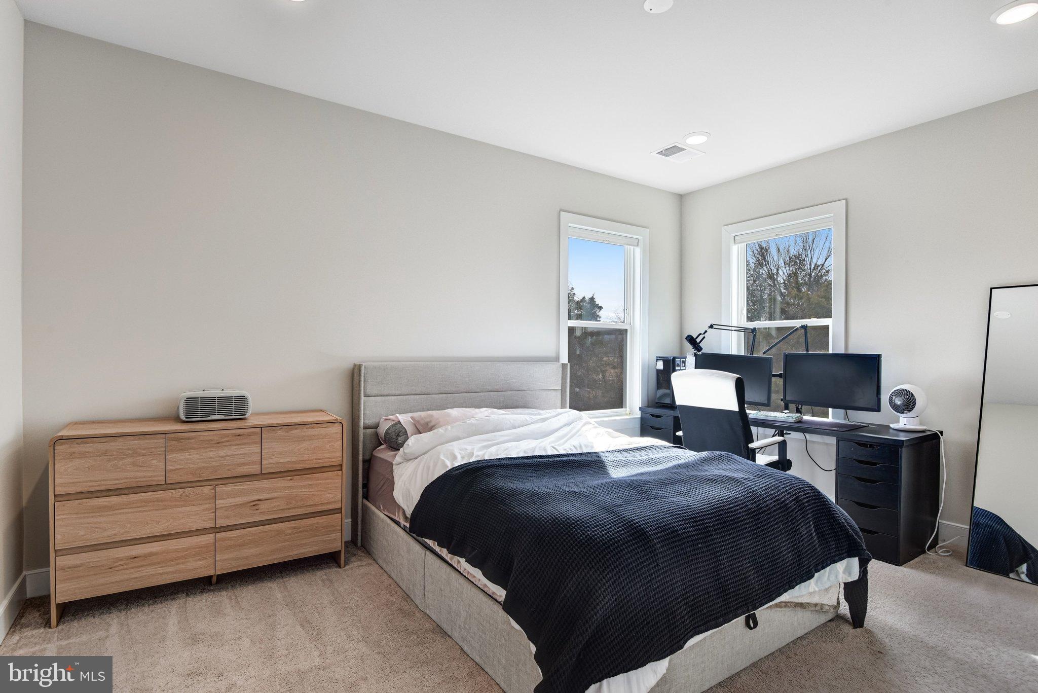 43199 Dogan Rdg Place Centreville, VA 20120 - Photo 52 of 86 a bedroom with a bed and a dressers