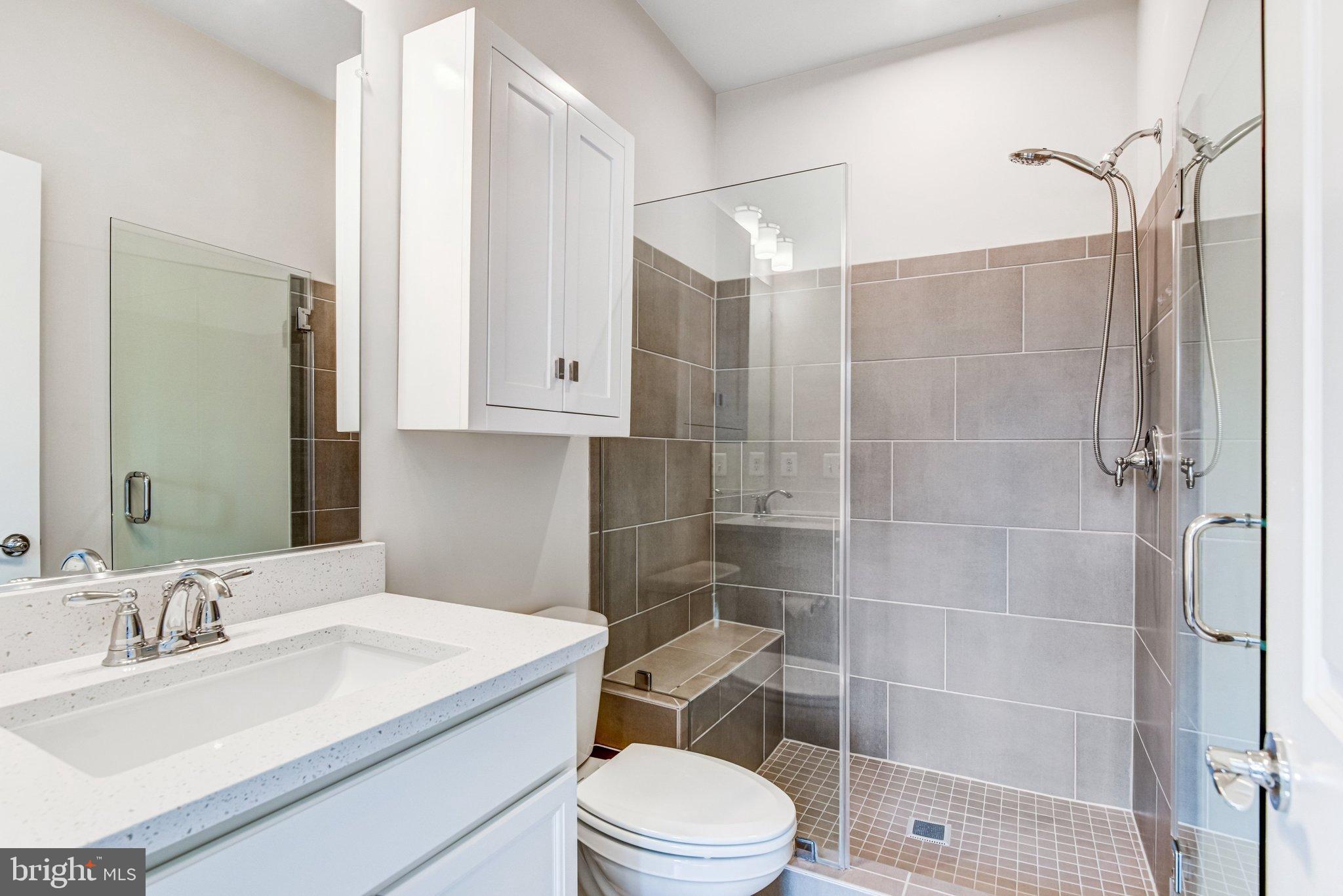 43199 Dogan Rdg Place Centreville, VA 20120 - Photo 54 of 86 a bathroom with a sink toilet vanity and shower