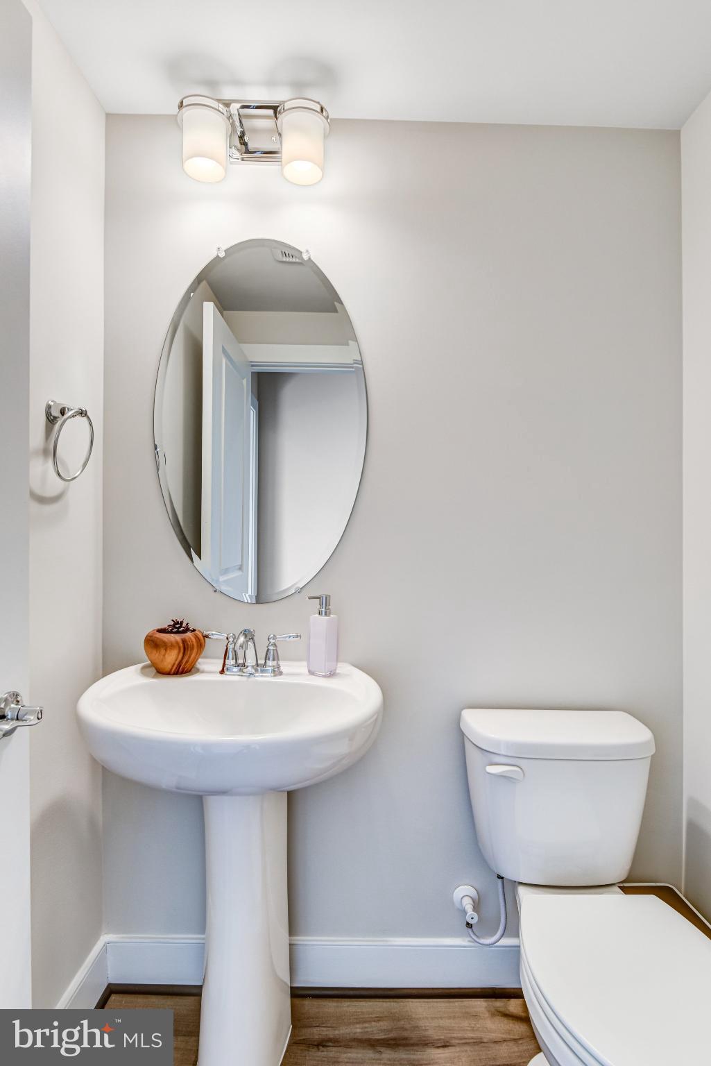 43199 Dogan Rdg Place Centreville, VA 20120 - Photo 57 of 86 a bathroom with a toilet sink and mirror