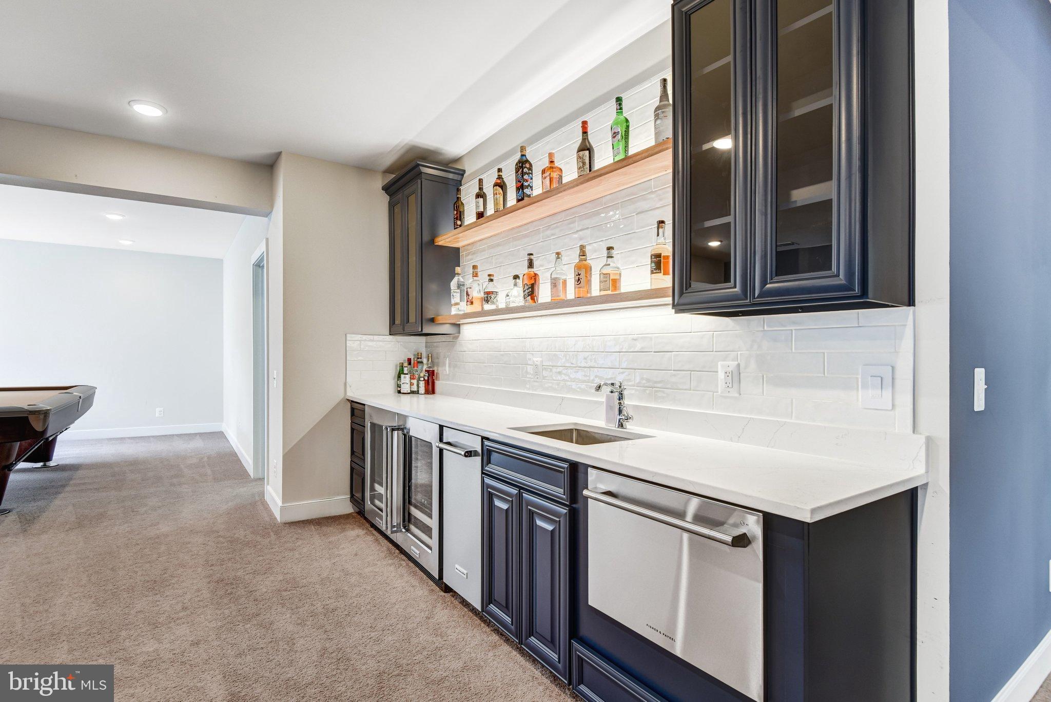 43199 Dogan Rdg Place Centreville, VA 20120 - Photo 66 of 86 a kitchen with stainless steel appliances granite countertop a sink and a stove top oven