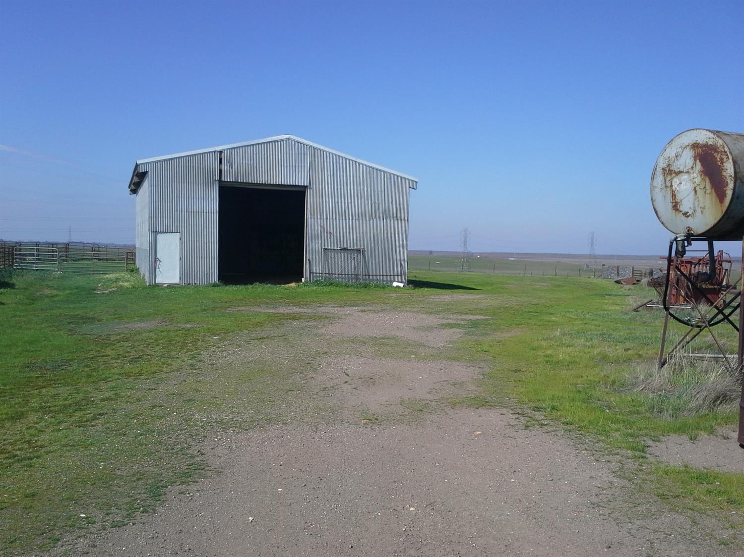 29939 Highway 4 Farmington, CA 95230 - Photo 11 of 25 a view of a backyard with a barn