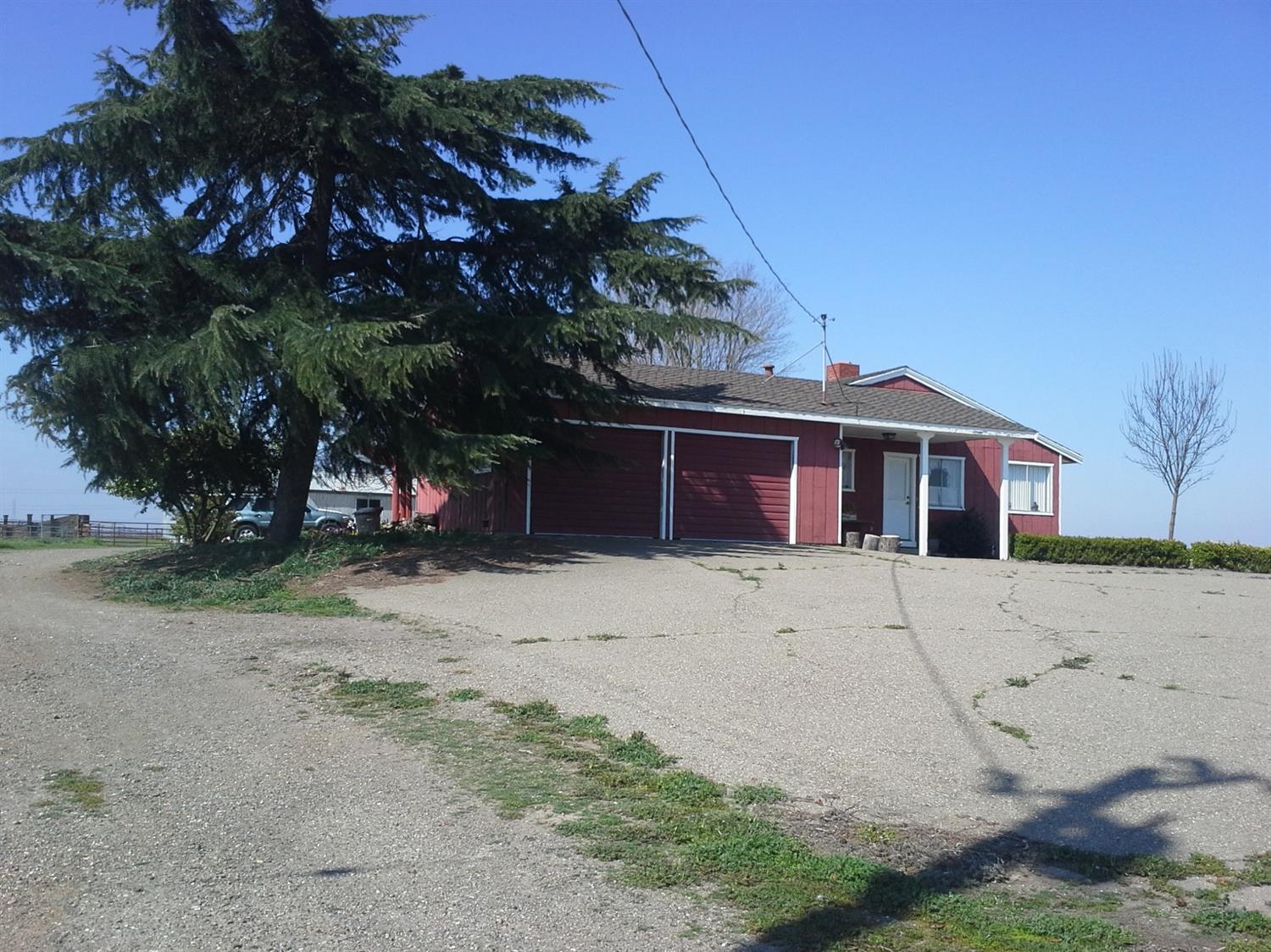 29939 Highway 4 Farmington, CA 95230 - Photo 14 of 25 a front view of a house with a yard