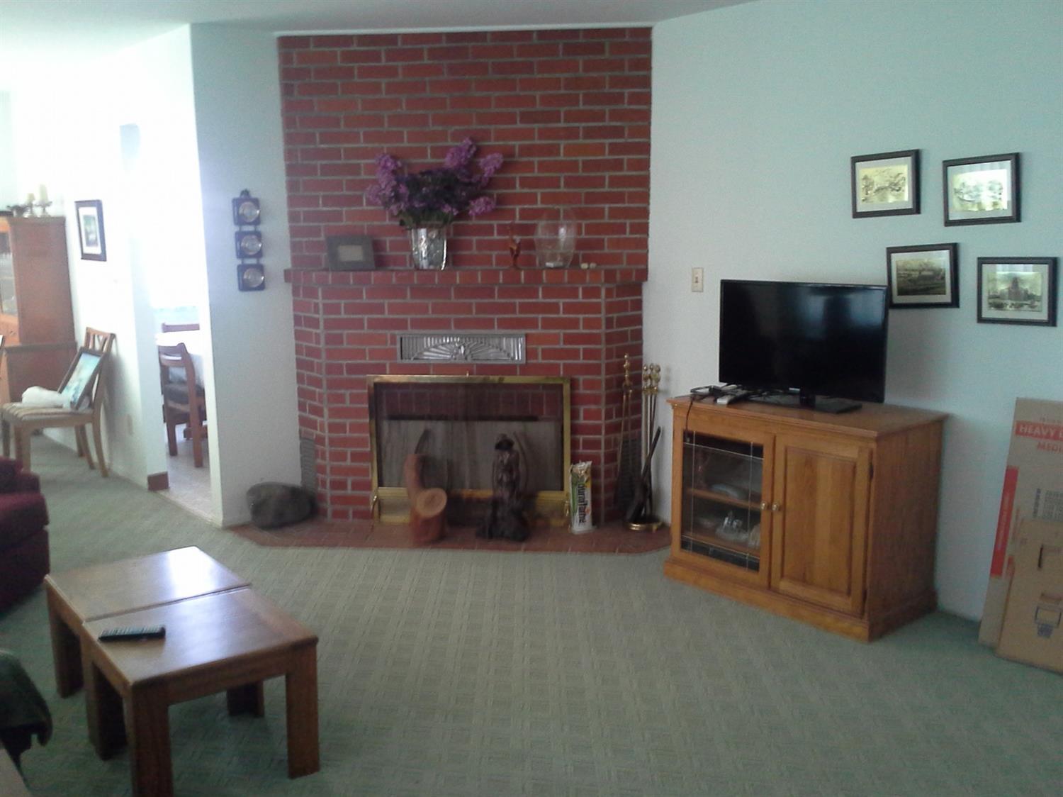 29939 Highway 4 Farmington, CA 95230 - Photo 17 of 25 a living room with furniture and a fireplace