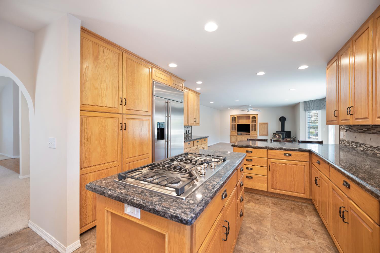 3730 Kimo Way Auburn, CA 95602 - Photo 21 of 75 a kitchen with stainless steel appliances granite countertop a sink stove and refrigerator