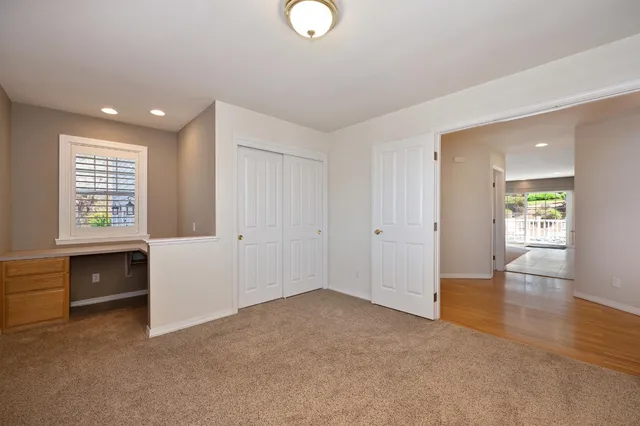 a living room with furniture pool table and a flat screen tv