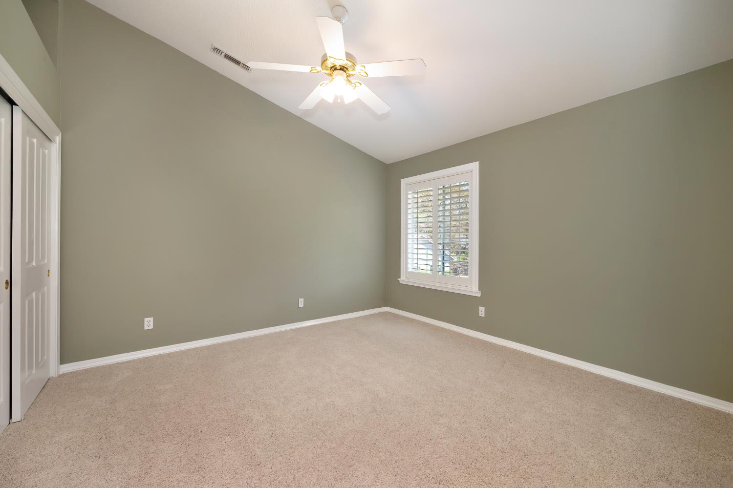 3730 Kimo Way Auburn, CA 95602 - Photo 37 of 75 an empty room with windows and fan