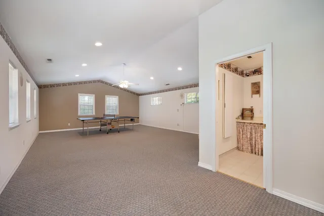 a front view of a house with a street