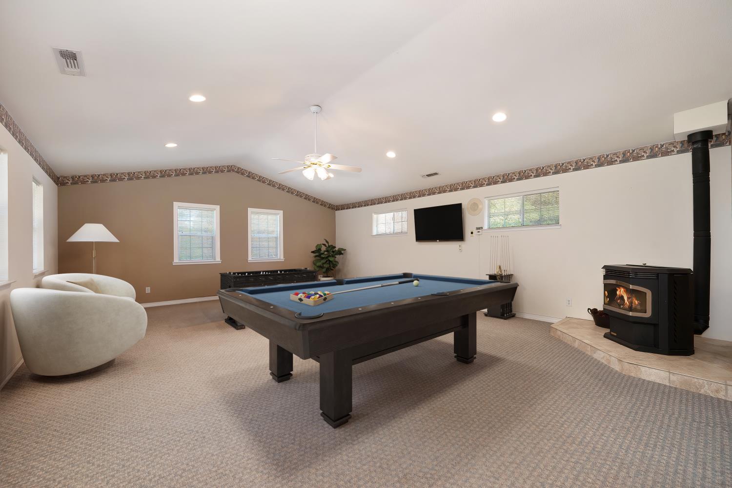 3730 Kimo Way Auburn, CA 95602 - Photo 41 of 75 a living room with furniture pool table and a flat screen tv