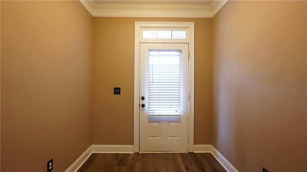 548 Myrtle Trace Lane Suwanee, GA 30024 - Photo 14 of 87 a view of small space with wooden floor and a window