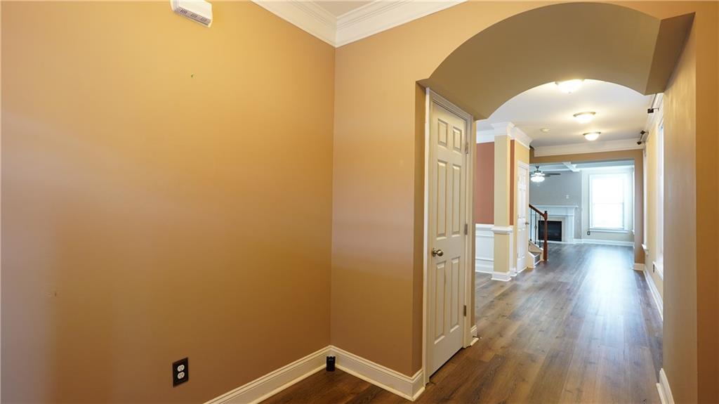 548 Myrtle Trace Lane Suwanee, GA 30024 - Photo 17 of 74 a view of a hallway with wooden floor