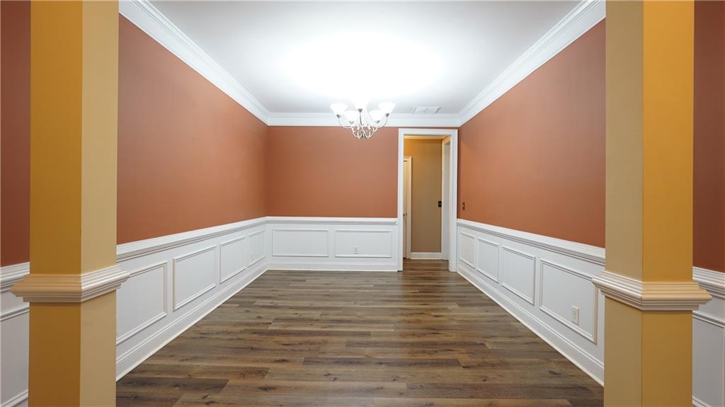 548 Myrtle Trace Lane Suwanee, GA 30024 - Photo 18 of 74 a view of an empty room with wooden floor