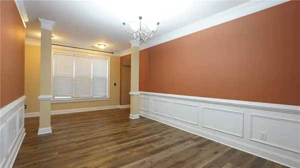 a kitchen with granite countertop a stove and cabinets