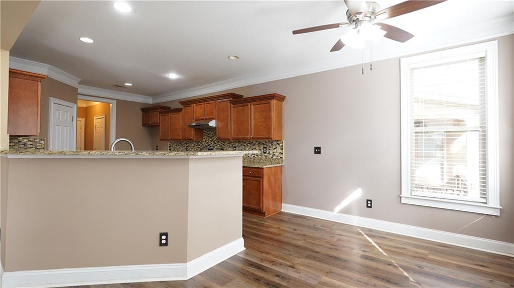 548 Myrtle Trace Lane Suwanee, GA 30024 - Photo 23 of 74 a view of a kitchen with a sink and cabinets