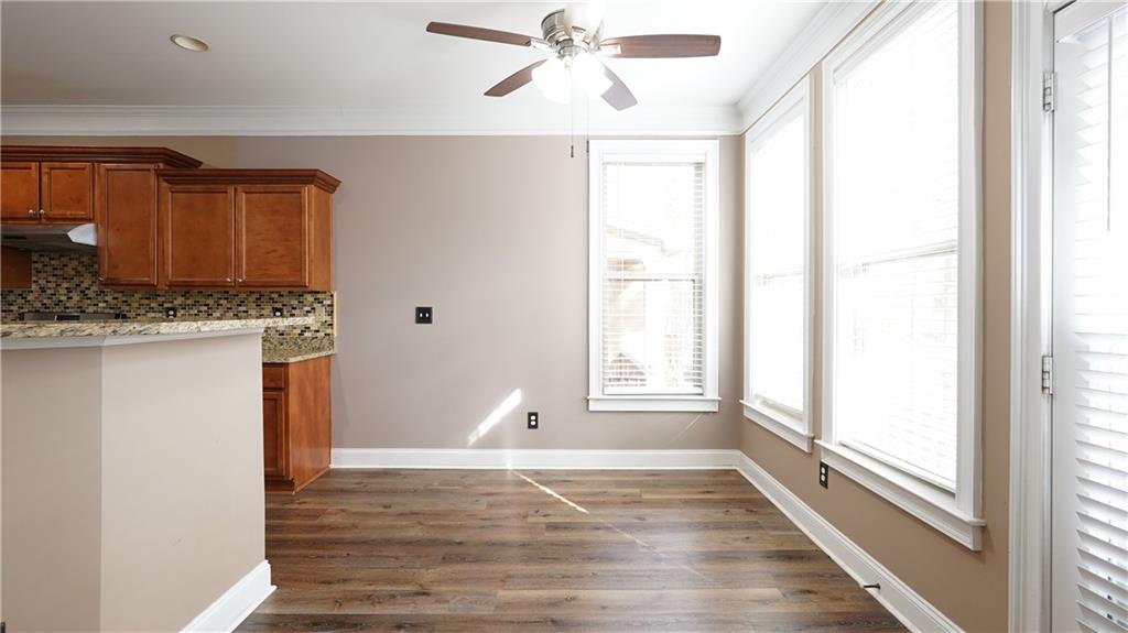 548 Myrtle Trace Lane Suwanee, GA 30024 - Photo 24 of 74 a view of a kitchen with a sink and wooden floor