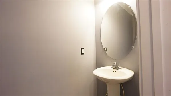 a spacious bathroom with a double vanity sink a mirror and a shower