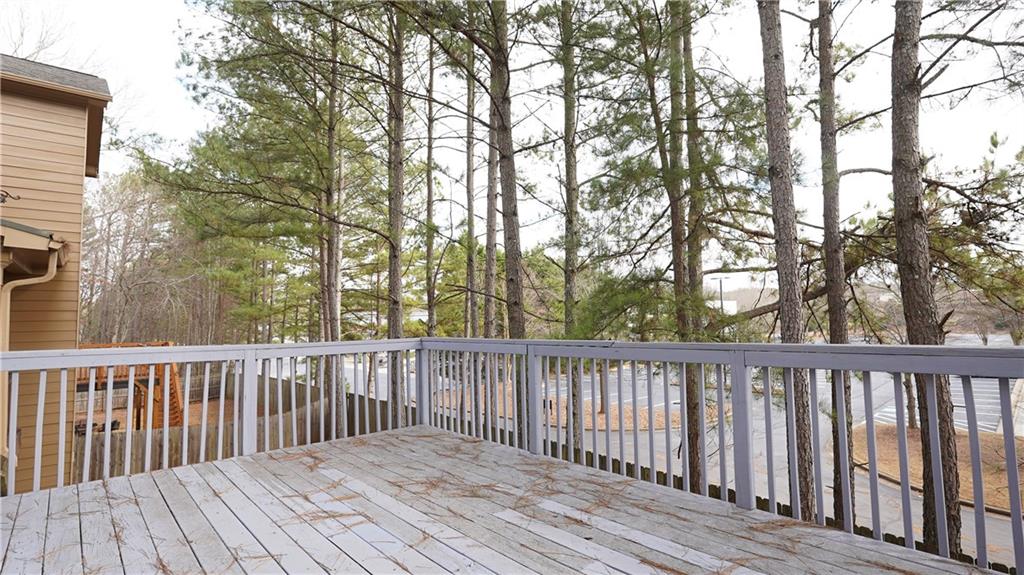 548 Myrtle Trace Lane Suwanee, GA 30024 - Photo 32 of 74 a balcony with wooden floor and fence