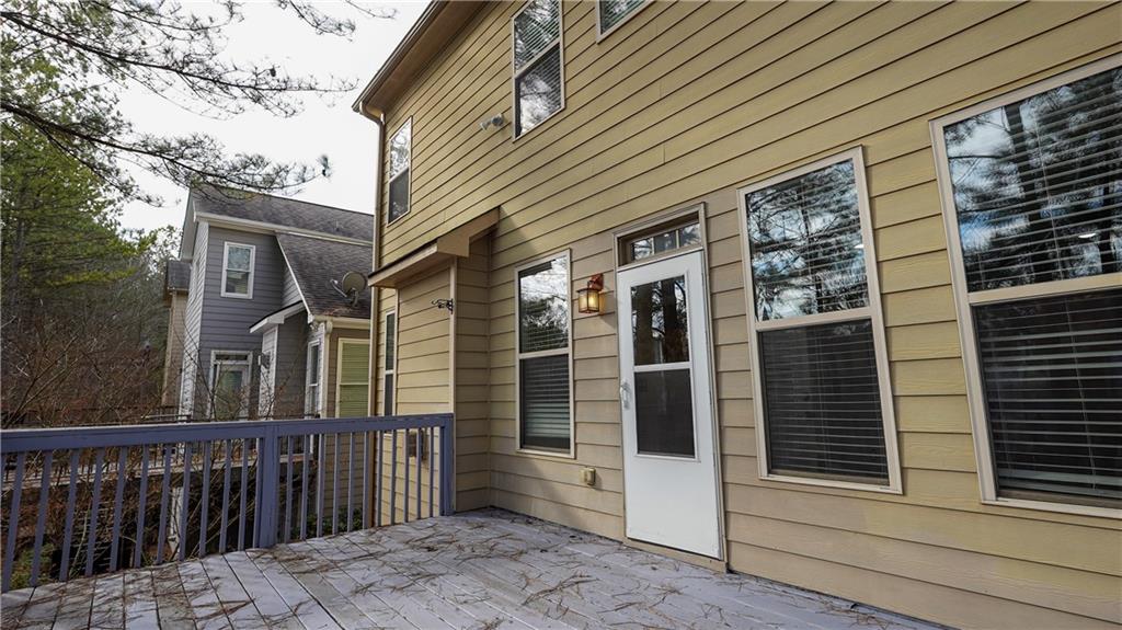 548 Myrtle Trace Lane Suwanee, GA 30024 - Photo 33 of 74 a view of a brick house with a large window