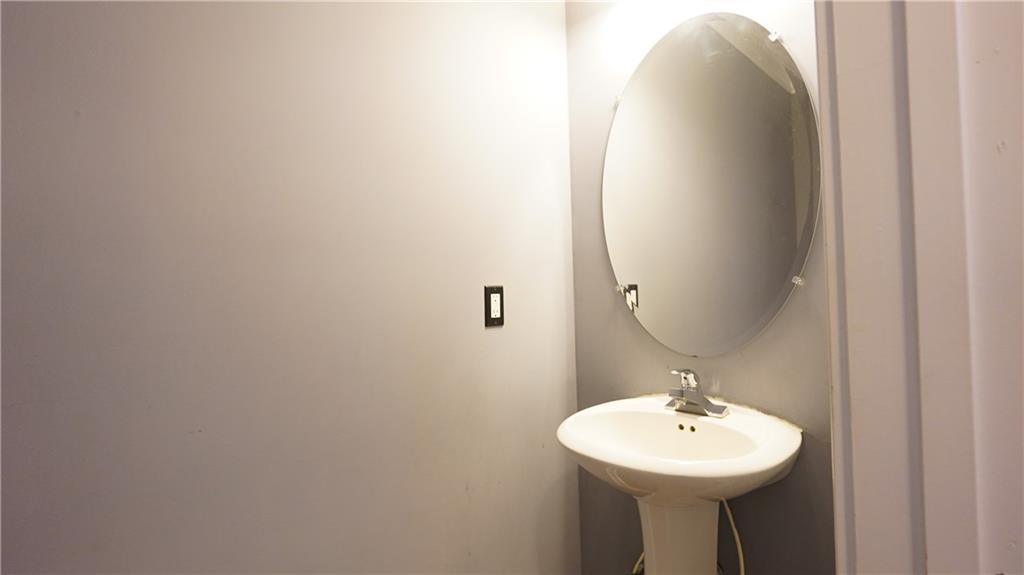 548 Myrtle Trace Lane Suwanee, GA 30024 - Photo 34 of 87 a bathroom with a sink and mirror