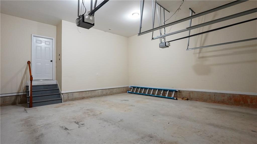 548 Myrtle Trace Lane Suwanee, GA 30024 - Photo 36 of 87 a view of a room with racks on the wall