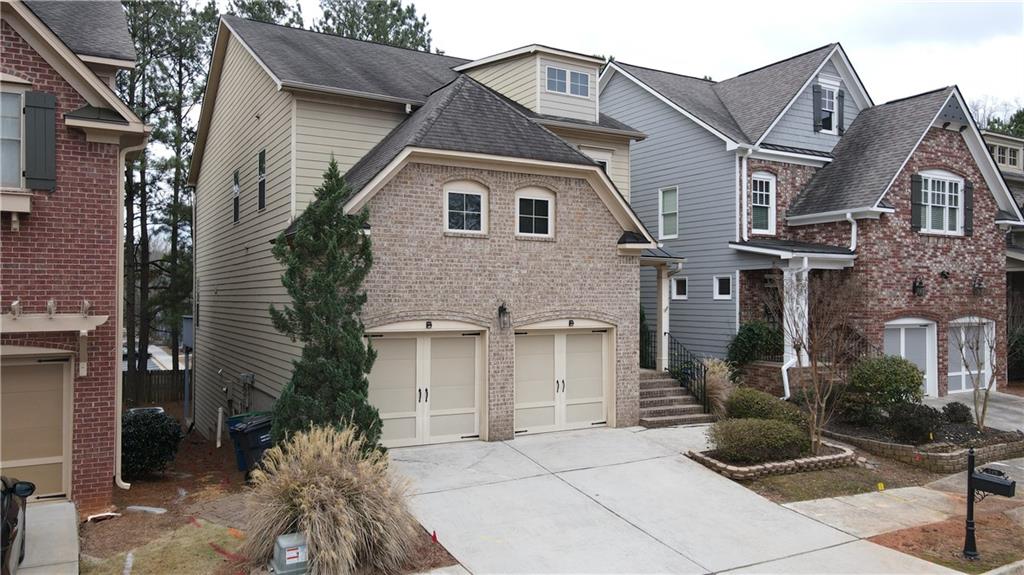 548 Myrtle Trace Lane Suwanee, GA 30024 - Photo 4 of 87 a front view of a house with garage