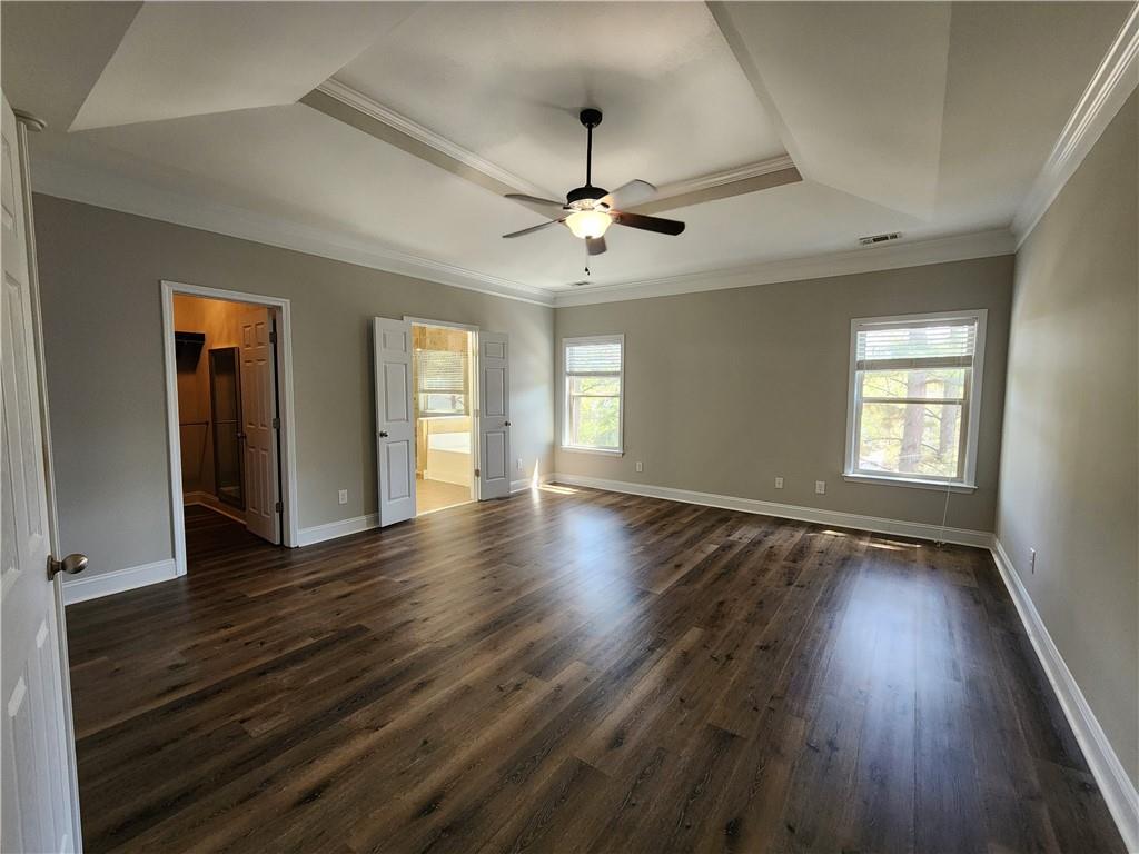 548 Myrtle Trace Lane Suwanee, GA 30024 - Photo 44 of 87 wooden floor in an empty room with a window