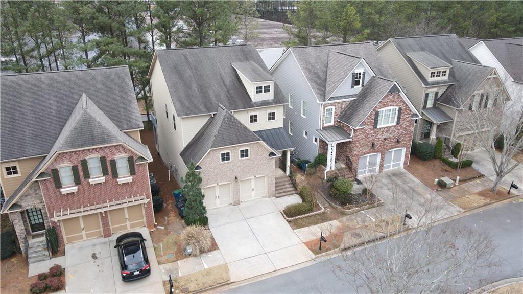 548 Myrtle Trace Lane Suwanee, GA 30024 - Photo 5 of 74 an aerial view of residential houses with parking space