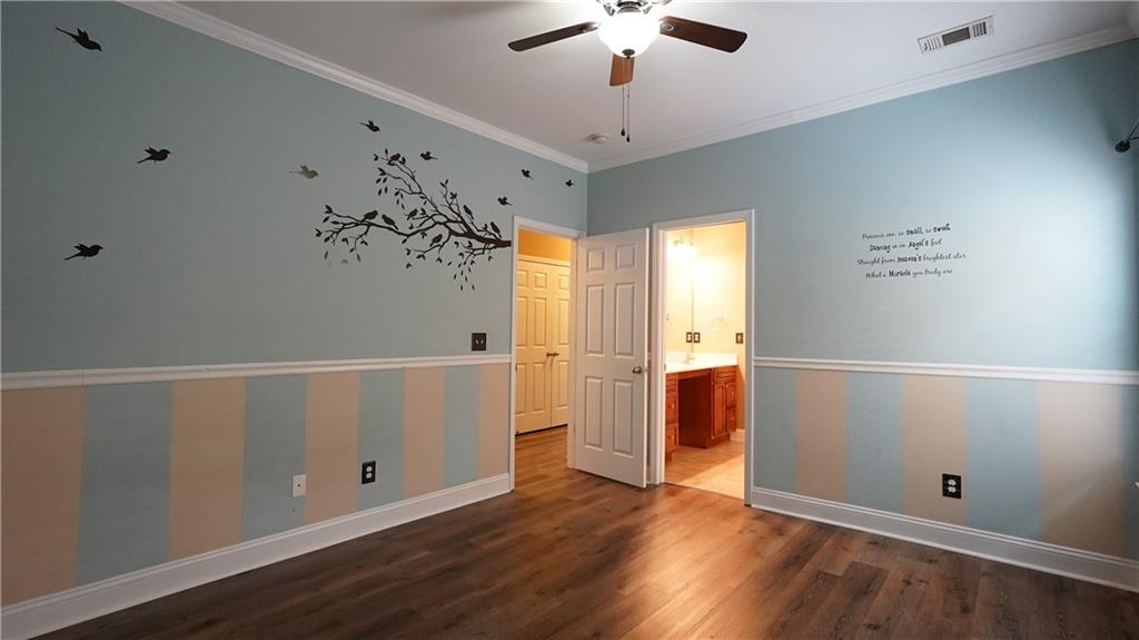 548 Myrtle Trace Lane Suwanee, GA 30024 - Photo 54 of 87 wooden floor in an empty room with a window