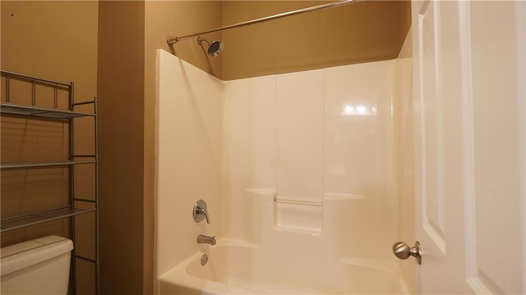 548 Myrtle Trace Lane Suwanee, GA 30024 - Photo 56 of 87 a bathroom with a shower and a toilet