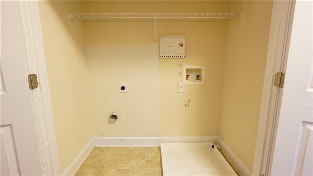 548 Myrtle Trace Lane Suwanee, GA 30024 - Photo 58 of 74 a bathroom with a tub