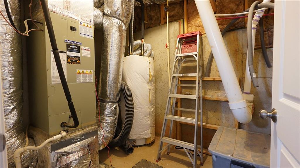 548 Myrtle Trace Lane Suwanee, GA 30024 - Photo 67 of 74 a view of walk in closet with wooden floor