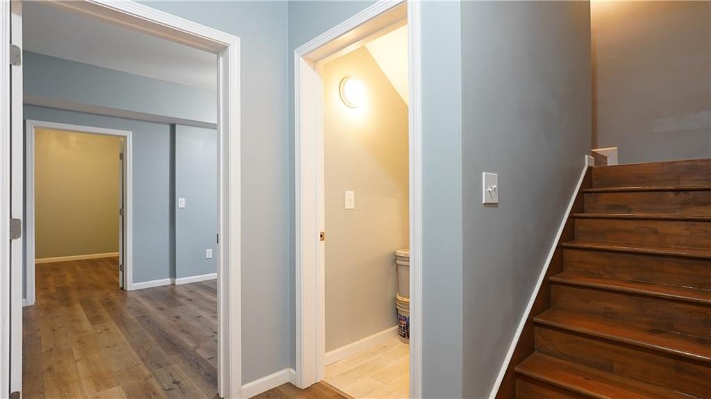 548 Myrtle Trace Lane Suwanee, GA 30024 - Photo 69 of 74 a view of a hallway with wooden floor and entryway