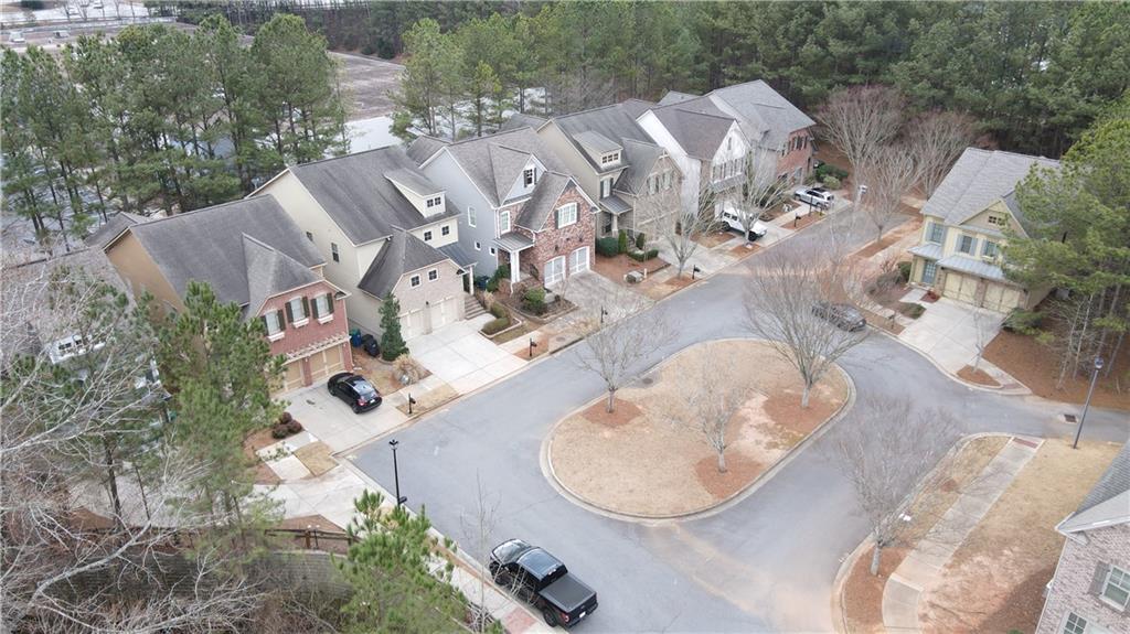 548 Myrtle Trace Lane Suwanee, GA 30024 - Photo 8 of 87 an aerial view of a house with a swimming pool and outdoor space
