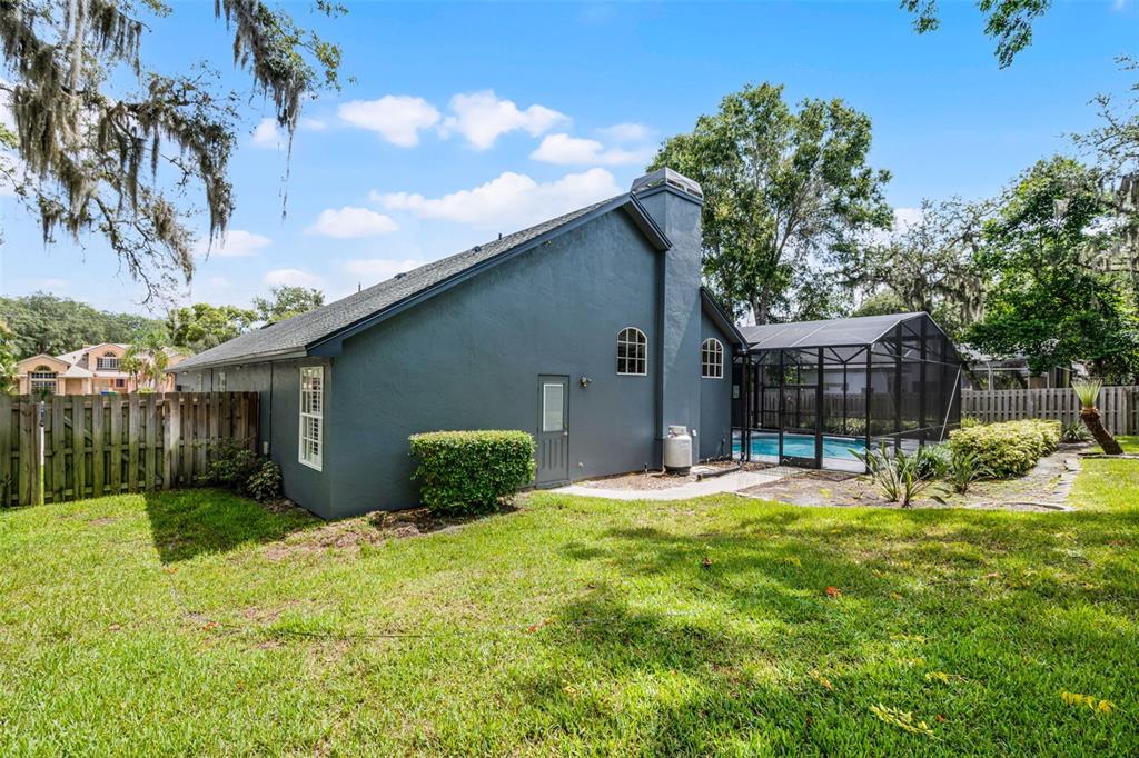 315 Lake Road Lake Mary, FL 32746 - Photo 52 of 65 NORTH SIDE HOUSE VIEW WITH BATH DOOR
