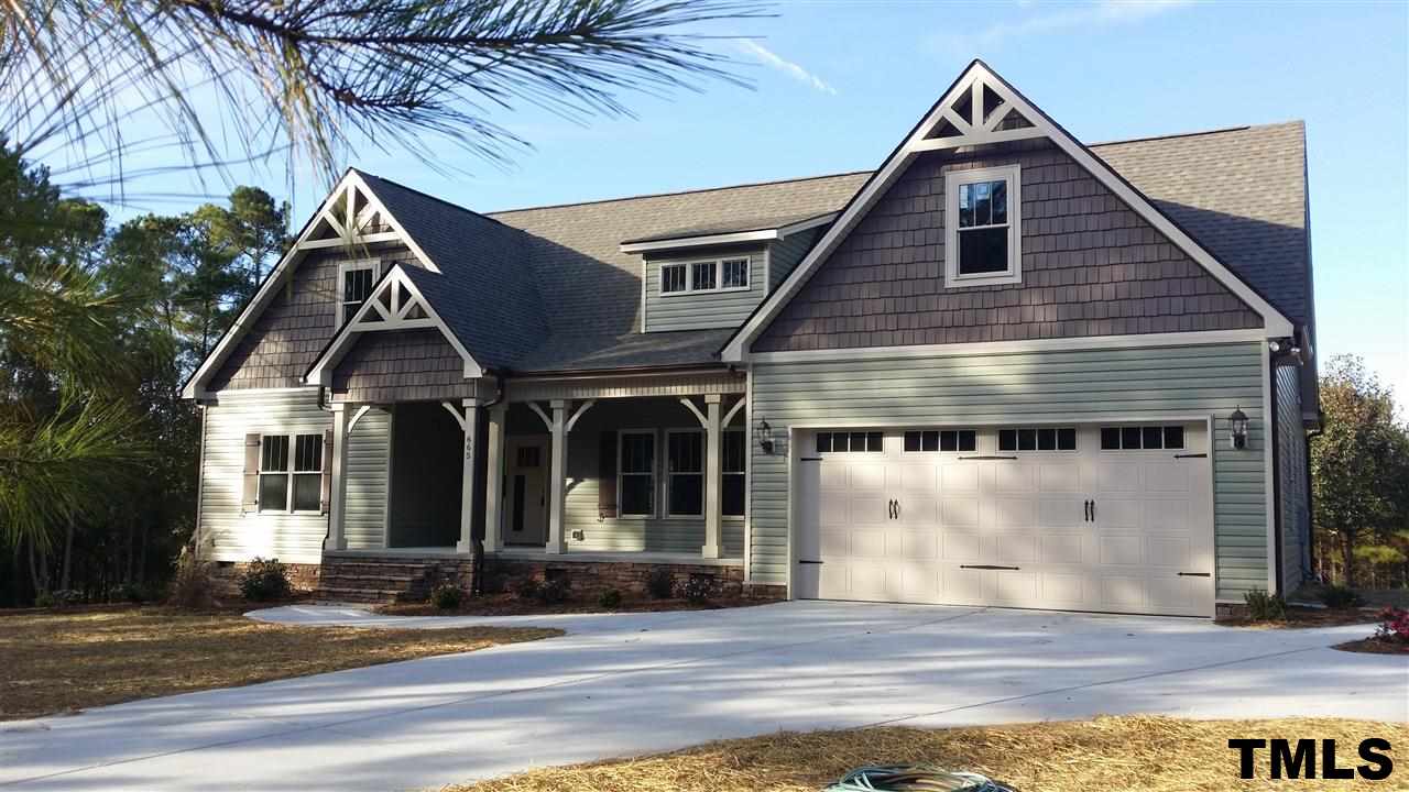 665 Tilghman Road Coats, NC 27521 - Photo 1 of 25 a view of a house with a patio