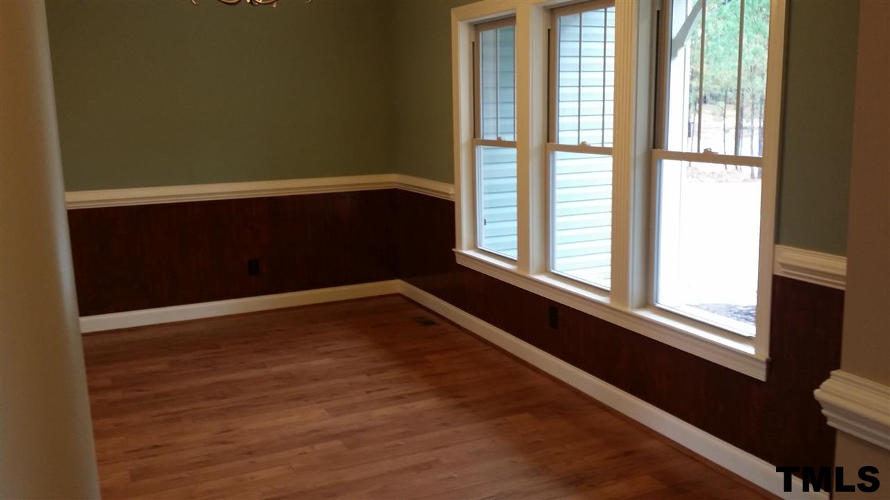 665 Tilghman Road Coats, NC 27521 - Photo 7 of 25 a view of an empty room with a window