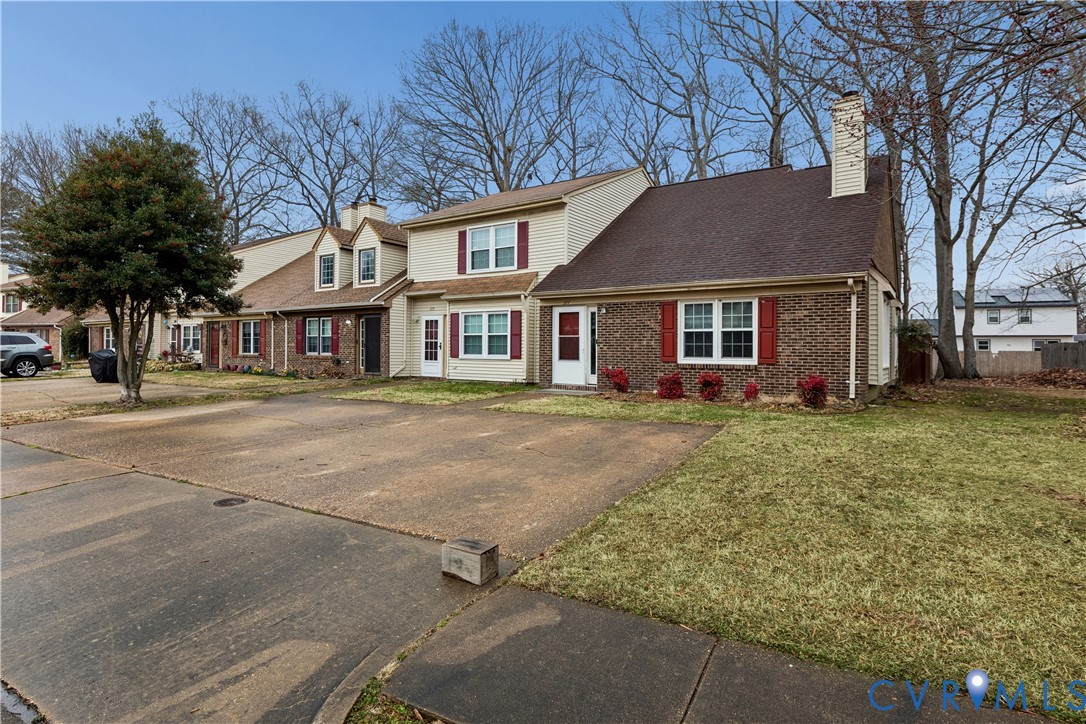 377 Kinsmen Way Hampton, VA 23666 - Photo 3 of 30 a front view of a house with a yard