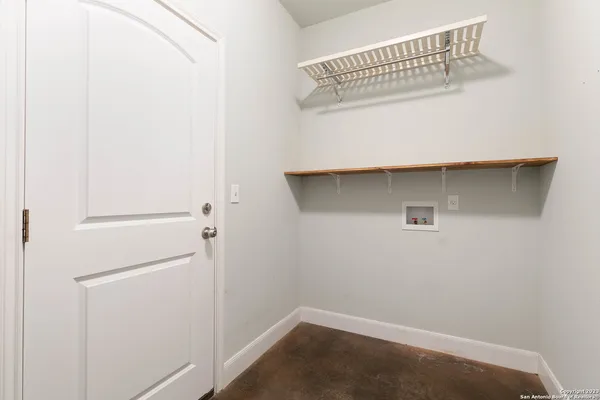 a view of small space with racks on the wall