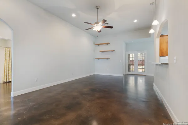 wooden floor in an empty room with a window