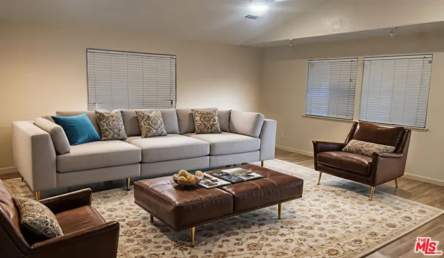 a living room with furniture and rug