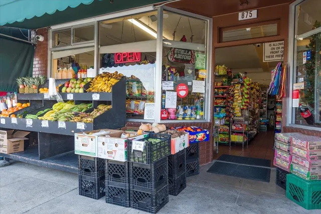 a store filled with lots of fruit and vegetables