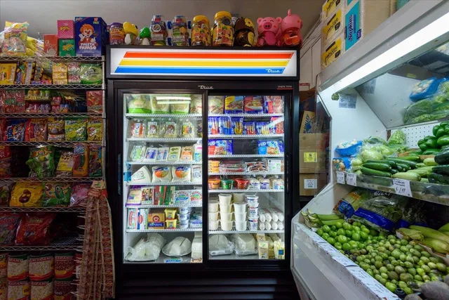 a store room with lots of fruit and vegetables