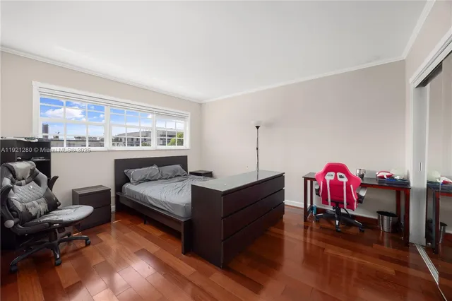 a bedroom with furniture and a window