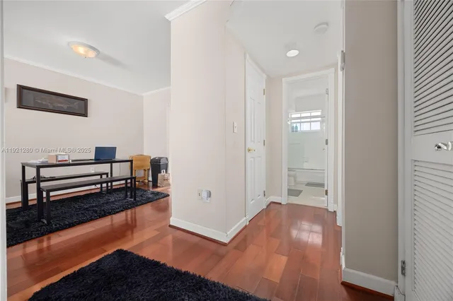 a view of a livingroom with furniture and an empty room