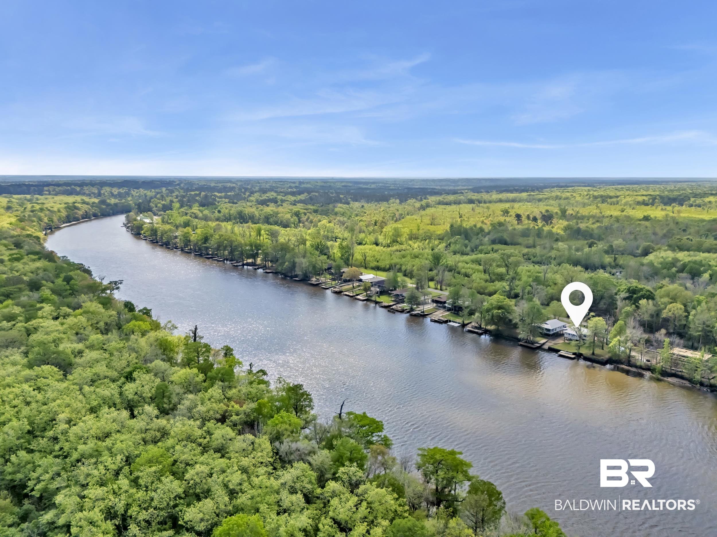 8081 Bryant's Lndg Road Stockton, AL 36579 - Photo 39 of 48 Drone / aerial view of a forest and a large body of water