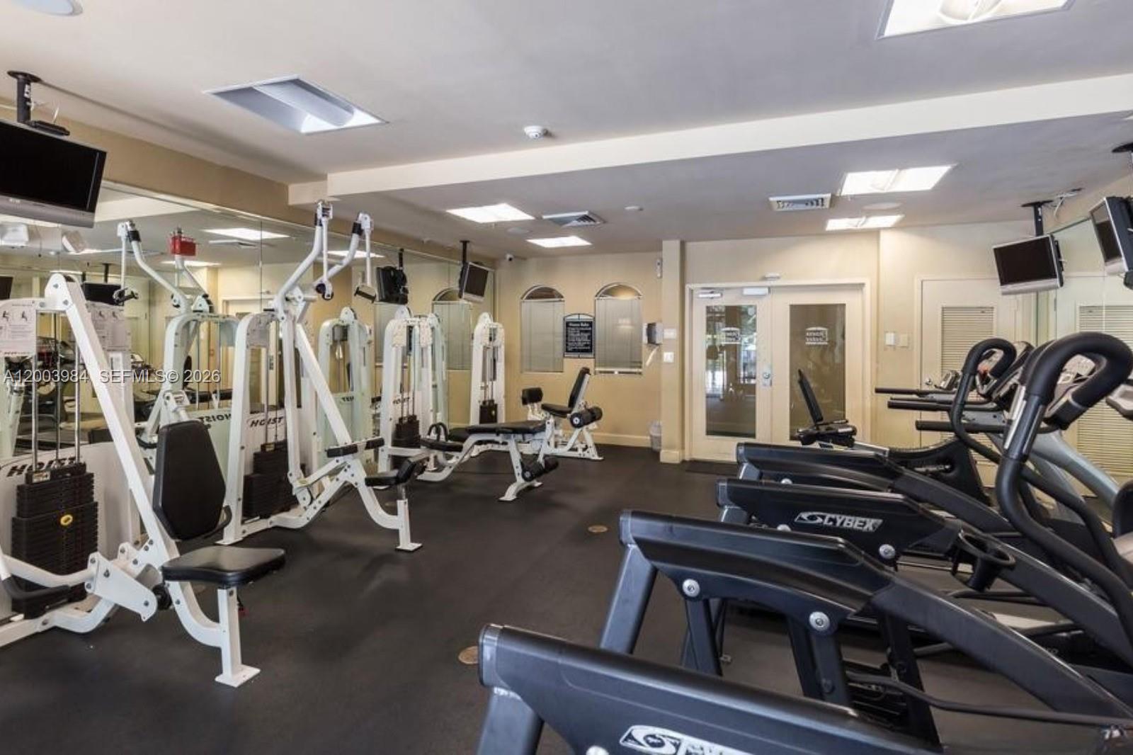 6001 Southwest 70th Street, Unit 342 South Miami, FL 33143 - Photo 16 of 19 a view of a room with gym equipment