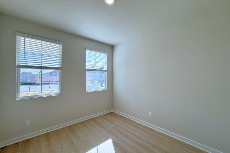 6508 Smarty Jones Lane Buda, TX 78610 - Photo 5 of 9 an empty room with a window