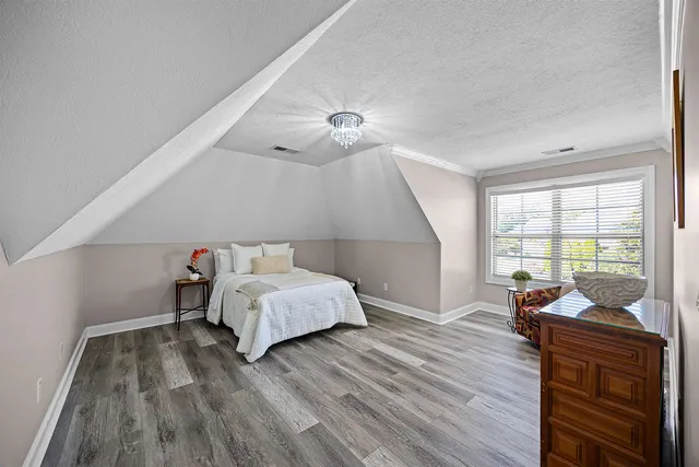 a bed room with a bed and a window