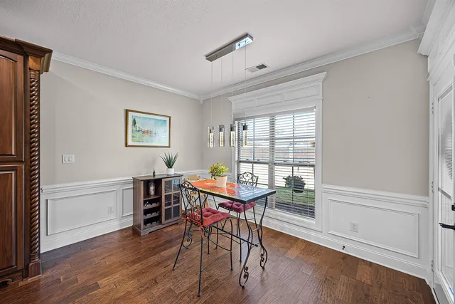 a workspace with furniture window and wooden floor