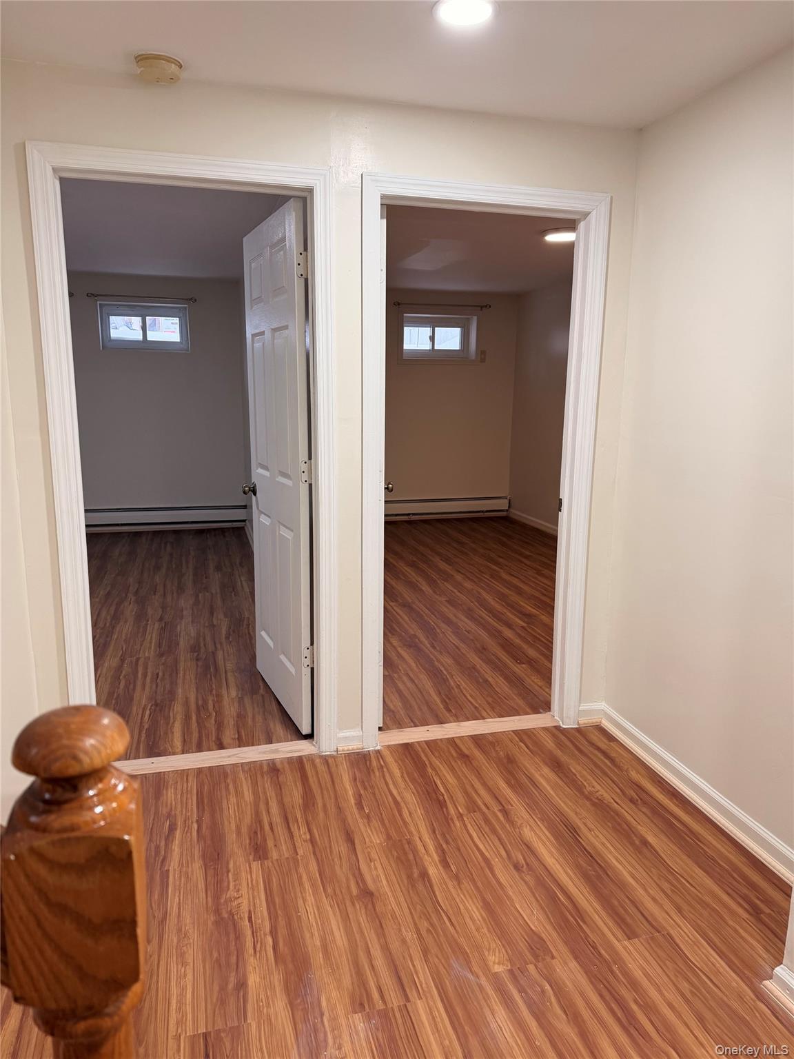 153-17 110th Road, Unit 1R Queens, NY 11433 - Photo 11 of 14 a view of a livingroom with wooden floor and closet
