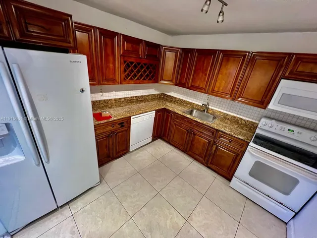 an empty room with wooden floor